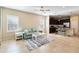 Open concept living room with kitchen and access to backyard at 5050 Maymont Park, Bradenton, FL 34203