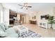 Open concept living room, kitchen and dining area with view to backyard at 5050 Maymont Park, Bradenton, FL 34203
