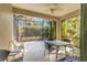 Spacious screened-in patio with table and chairs, great for outdoor dining at 5050 Maymont Park, Bradenton, FL 34203