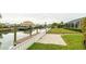 Private dock and canal access with a paved patio area at 517 71St St, Holmes Beach, FL 34217