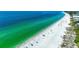 Aerial view of beach with white sand and clear water at 5613 Gulf Dr, Holmes Beach, FL 34217