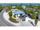 Aerial view of a single-Gathering home with a detached garage and ocean access at 5613 Gulf Dr, Holmes Beach, FL 34217