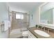 Clean bathroom featuring a shower/tub combo and granite countertop at 5613 Gulf Dr, Holmes Beach, FL 34217