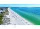 Expansive beach view with clear water at 5613 Gulf Dr, Holmes Beach, FL 34217
