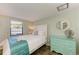 Bedroom with a queen-size bed and light teal accents at 5613 Gulf Dr, Holmes Beach, FL 34217