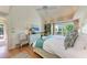 Main bedroom with king-size bed and private access to a balcony at 5613 Gulf Dr, Holmes Beach, FL 34217
