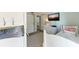 Bedroom with twin-size bunk beds, dresser, and beach-themed decor at 5613 Gulf Dr, Holmes Beach, FL 34217