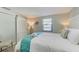 Bedroom featuring a queen-size bed and barn door at 5613 Gulf Dr, Holmes Beach, FL 34217