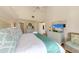 Main bedroom with king-size bed, dresser, and sitting area at 5613 Gulf Dr, Holmes Beach, FL 34217