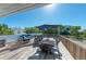Spacious deck with seating, dining area, and ocean views at 5613 Gulf Dr, Holmes Beach, FL 34217