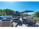 Spacious deck with multiple seating areas, dining table, and ocean views at 5613 Gulf Dr, Holmes Beach, FL 34217