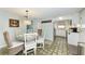 Bright dining area with a round table and beach-themed decor at 5613 Gulf Dr, Holmes Beach, FL 34217