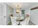 Charming dining area with a round table and kitchen view at 5613 Gulf Dr, Holmes Beach, FL 34217