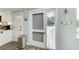 Front door entryway with a screen door and nautical decor at 5613 Gulf Dr, Holmes Beach, FL 34217