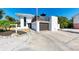 Two-story house with modern design and detached garage at 5613 Gulf Dr, Holmes Beach, FL 34217