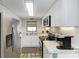 Well-equipped kitchen with stainless steel appliances and white cabinets at 5613 Gulf Dr, Holmes Beach, FL 34217