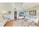 Bright living room with vaulted ceilings, hardwood floors, and comfy seating at 5613 Gulf Dr, Holmes Beach, FL 34217