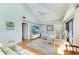 Bright living room with vaulted ceilings, hardwood floors, and comfy seating at 5613 Gulf Dr, Holmes Beach, FL 34217