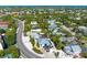 Wide aerial showcasing home and beach access at 5613 Gulf Dr, Holmes Beach, FL 34217