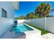 Modern, rectangular pool with built-in seating at 5613 Gulf Dr, Holmes Beach, FL 34217