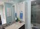 Bathroom with single sink vanity and walk-in shower at 5619 Bayshore Rd # 115, Palmetto, FL 34221