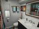 Updated bathroom with marble vanity, decorative towels, and framed nautical print at 5619 Bayshore Rd # 115, Palmetto, FL 34221
