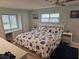 Main bedroom with a king-size bed and window seating at 5619 Bayshore Rd # 115, Palmetto, FL 34221