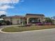 Community building with attractive landscaping and signage at 5619 Bayshore Rd # 115, Palmetto, FL 34221