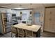 Modern kitchen with stainless steel appliances and island at 5619 Bayshore Rd # 115, Palmetto, FL 34221