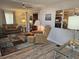 Living room with comfy seating and wood-look flooring at 5619 Bayshore Rd # 115, Palmetto, FL 34221