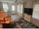 Living room featuring a large TV and comfy seating at 5619 Bayshore Rd # 115, Palmetto, FL 34221