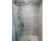 Walk-in shower with tile surround and glass door at 5619 Bayshore Rd # 115, Palmetto, FL 34221