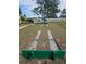 Outdoor shuffleboard court with green painted boards and concrete playing surface at 5619 Bayshore Rd # 115, Palmetto, FL 34221