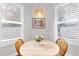 Bright breakfast nook with wood table and window seating at 5726 Aaron Ct, Sarasota, FL 34232