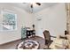Home office with built-in shelving and wood desk at 5726 Aaron Ct, Sarasota, FL 34232