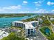 Aerial view of waterfront property with marina at 5855 Midnight Pass Rd # 311, Sarasota, FL 34242