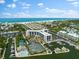 Aerial view of waterfront property with marina at 5855 Midnight Pass Rd # 311, Sarasota, FL 34242