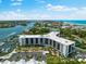 Aerial view of waterfront property with marina at 5855 Midnight Pass Rd # 311, Sarasota, FL 34242