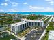 Aerial view of waterfront property with marina at 5855 Midnight Pass Rd # 311, Sarasota, FL 34242