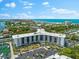 Aerial view of waterfront property with marina at 5855 Midnight Pass Rd # 311, Sarasota, FL 34242