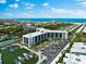 Aerial view of waterfront property with marina at 5855 Midnight Pass Rd # 311, Sarasota, FL 34242