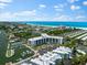 Aerial view of waterfront property with marina at 5855 Midnight Pass Rd # 311, Sarasota, FL 34242