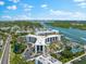 Aerial view of waterfront condo community with tennis courts and marina at 5855 Midnight Pass Rd # 311, Sarasota, FL 34242