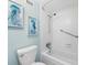 Clean bathroom with shower/tub combo and beach-themed decor at 5855 Midnight Pass Rd # 311, Sarasota, FL 34242