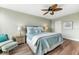 Bright bedroom with a king-size bed and ceiling fan at 5855 Midnight Pass Rd # 311, Sarasota, FL 34242
