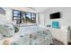 Coastal-themed bedroom with a queen bed and water view at 5855 Midnight Pass Rd # 311, Sarasota, FL 34242