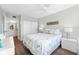 Bedroom with queen bed, closet, and bathroom access at 5855 Midnight Pass Rd # 311, Sarasota, FL 34242