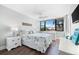 Bedroom with a queen bed and water view at 5855 Midnight Pass Rd # 311, Sarasota, FL 34242
