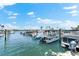 Community boat docks with various boats at 5855 Midnight Pass Rd # 311, Sarasota, FL 34242