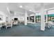 Spacious community room with comfortable seating and access to outdoor patio at 5855 Midnight Pass Rd # 311, Sarasota, FL 34242